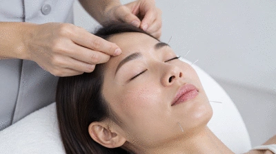 User receiving acupuncture treatment for eye health